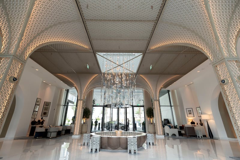 The lobby has arches, Arabian inspired water features and a modern glass chandelier