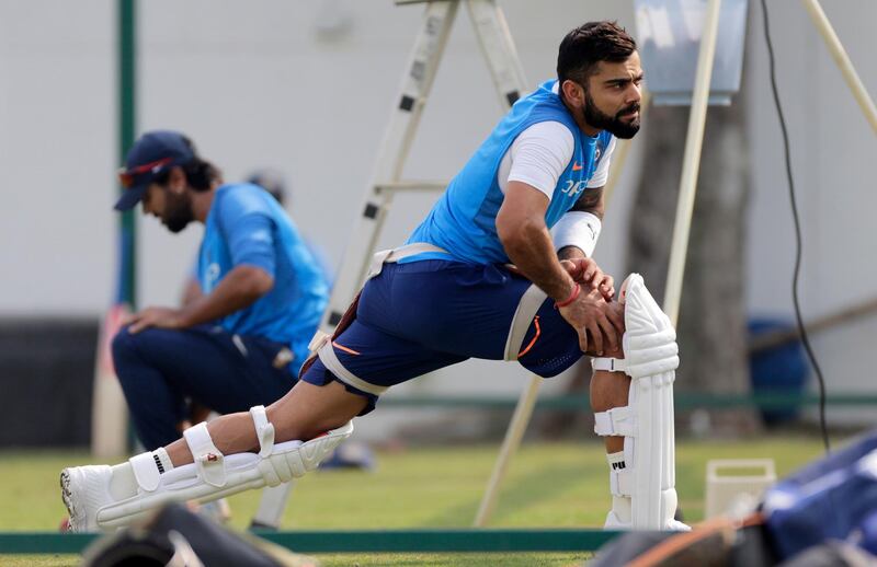 India's cricket captain Virat Kohli stretches during a practice session before their second test match against Sri Lanka in Nagpur, India, Thursday, Nov. 23, 2017. (AP Photo/Rajanish Kakade)