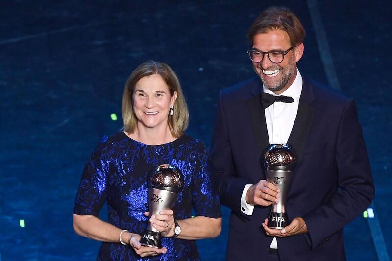 Best FIFA Women's Coach of 2019, USA head coach Jill Ellis (left) and Best FIFA Men's Coach of 2019 Liverpool coach, Germany's Jurgen Klopp pose at the end of The Best FIFA Football Awards ceremony. AFP