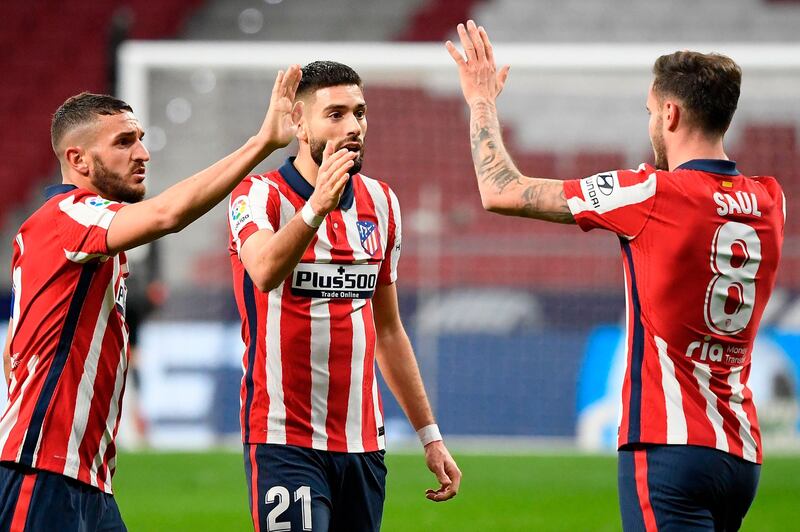 Atletico Madrid's Koke, Yannick Ferreira-Carrasco and Saul Niguez celebrate at the end of the match. AFP