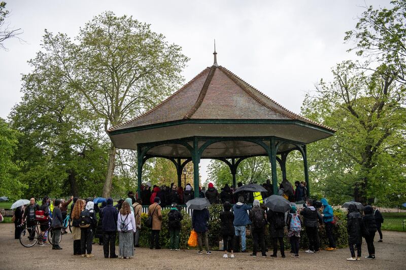 Friends and family hold a vigil for Sasha Johnson on a bandstand in Ruskin Park in London. Getty Images