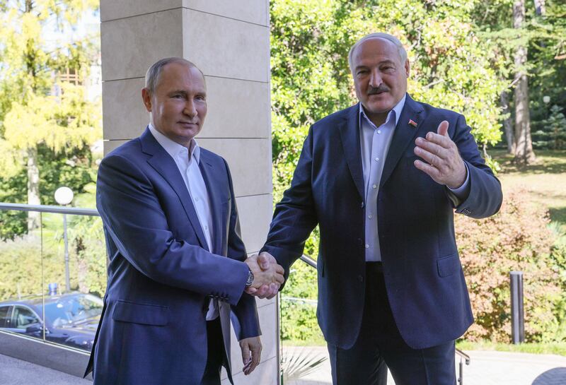 Russian President Vladimir Putin, left, shakes hands with Belarusian President Alexander Lukashenko in Sochi, Russia, on September 26. EPA