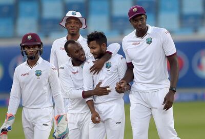 Devendra Bishoo, centre, produced bowling figures of eight for 49 on Day 4 of the Pakistan v West Indies Test match in Dubai in October 2017. Aamir Oureshi / AFP