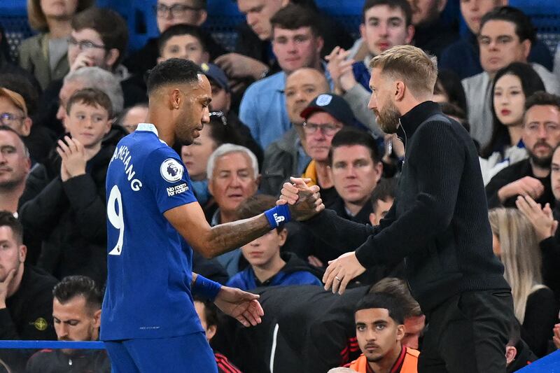 Pierre-Emerick Aubameyang shakes hands with Chelsea  coach Graham Potter. AFP