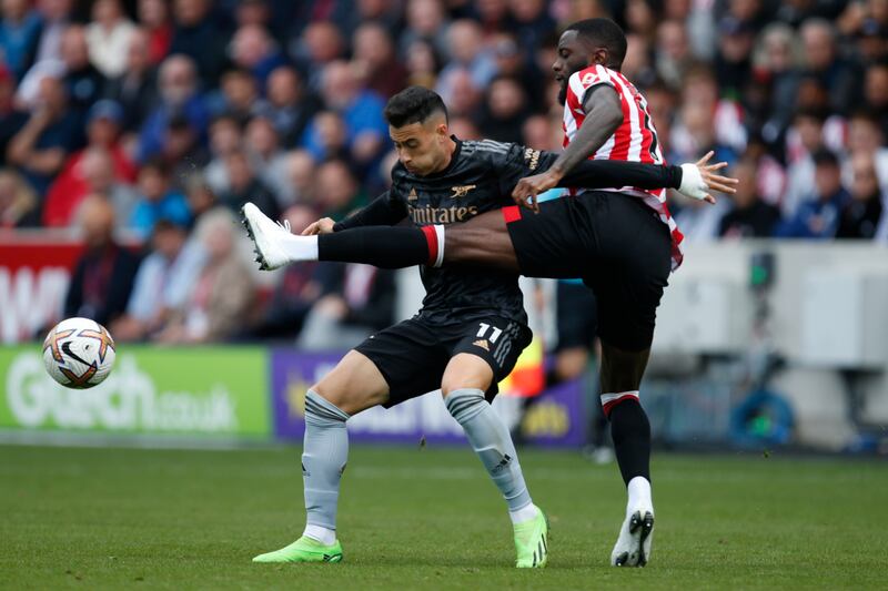 Arsenal's Gabriel Martinelli challenges Brentford's Ivan Toney. AP