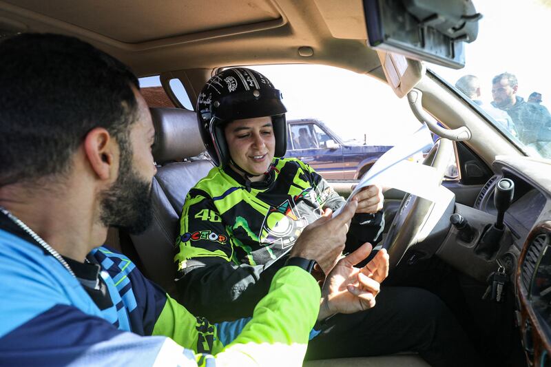 A female Tunisian driver during the Hamada al-Hamra auto rally held in an area about 180 kilometres south-west of Libya's capital, Tripoli. All photos: AFP