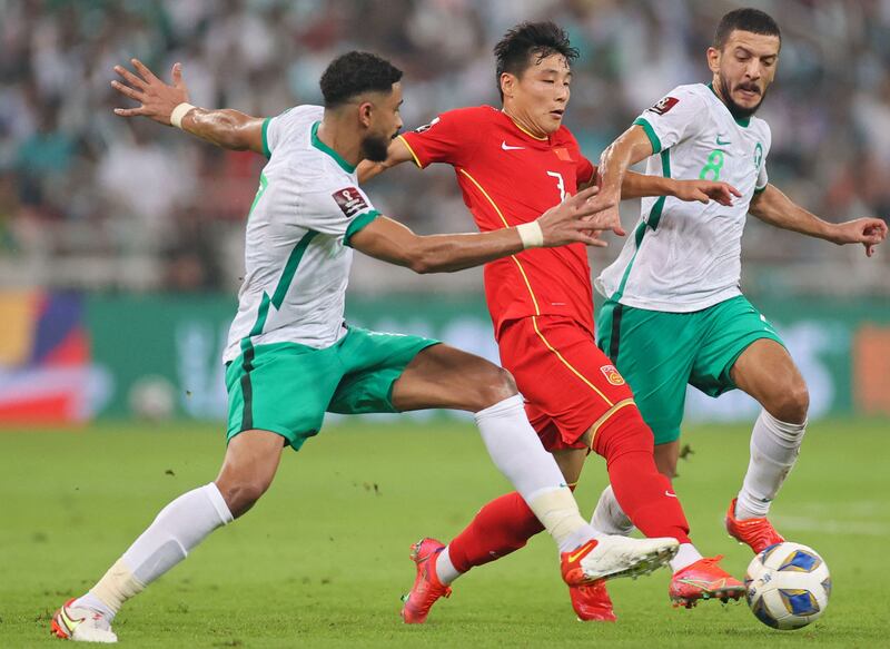 Chinese forward Wu Lei (C) finds the going tough in Jeddah. AFP