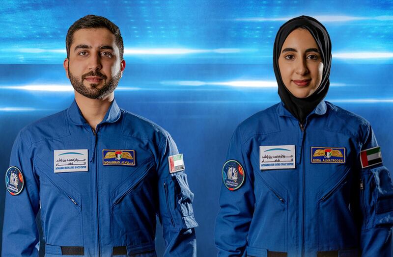 epa09126826 A handout photo made available by Emirates News Agency (WAM), shows Noura al-Matroushi (R) and Mohammed al-Mulla (L) the newly announced UAE's astronauts for the  country's space program, United Arab Emirates, 10 April 2021.  Vice President and Prime Minister of the UAE and Ruler of Dubai,  Sheikh Mohammed bin Rashid Al Maktoum, announced in a tweet that he named the first Arab female astronaut Emirati Noura Al Matrooshi in addition to countryman Mohammed Al Mulla they are to get trained at NASA's Johnson Space Center in Houston, Texas, and be part of the UAE's  space porgram. They were chosen from over 4,000 candidates.  EPA/EMIRATES NEWS AGENCY / HANDOUT HANDOUT  HANDOUT EDITORIAL USE ONLY/NO SALES