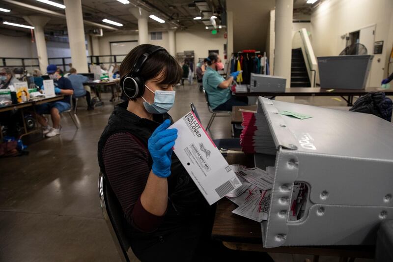 Election workers organise ballots at the Multnomah County Elections Division Tuesday in Portland, Oregon.  AP Photo