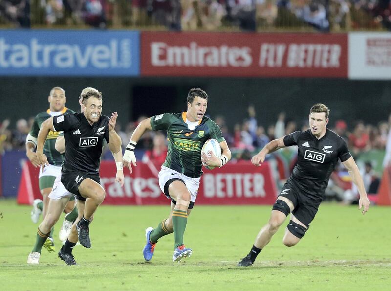 Dubai, United Arab Emirates - December 07, 2019: Ruhan Nel of New Zealand goes on a run during the game between New Zealand and South Africa in the mens final at the HSBC rugby sevens series 2020. Saturday, December 7th, 2019. The Sevens, Dubai. Chris Whiteoak / The National