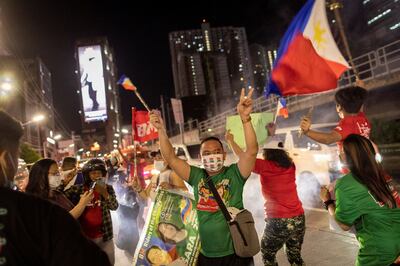 Supporters of presidential candidate Ferdinand Marcos Jr celebrate as partial results of the 2022 national elections show him with a wide lead. Reuters