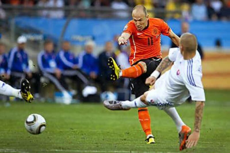 Arjen Robben strikes the game's opening goal for Holland.