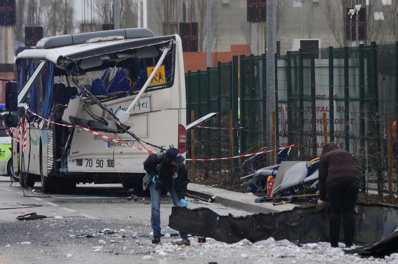 French forensic police work near the wreckage of the school bus-lorry crash near Rochefort. Xavier Leoty / AFP Photo