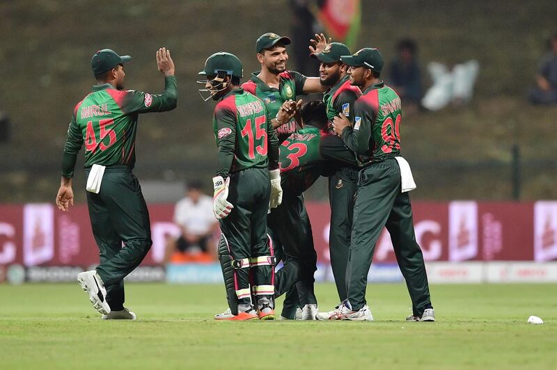 Bangladesh Nazmul Islam celebrates with his team after he dismissed Afghanistan batsman Rahmat Shah during the one day international (ODI) Asia Cup cricket match between Afghanistan and Bangladesh at The Sheikh Zayed Stadium in Abu Dhabi on September 23, 2018.  / AFP / GIUSEPPE CACACE
