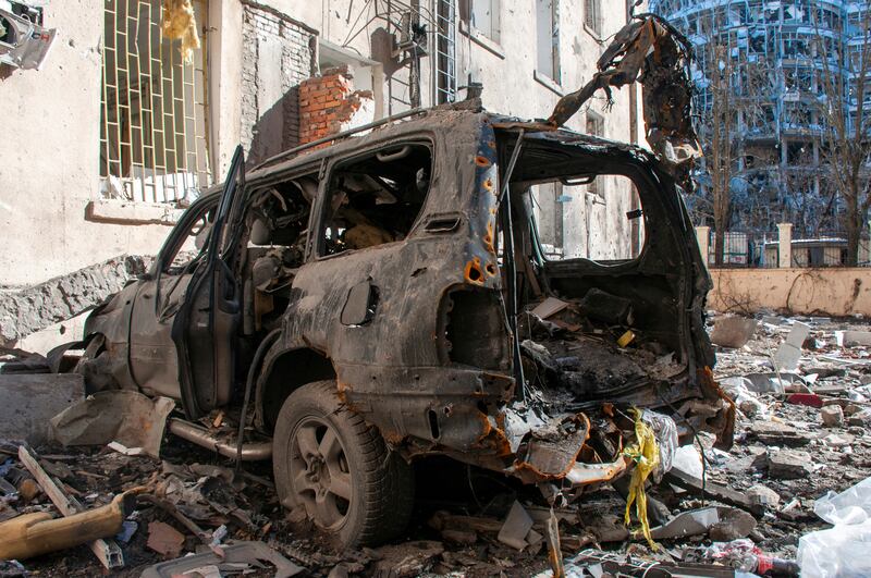 A wrecked car in a ruined street in Kharkiv, Ukraine. AP