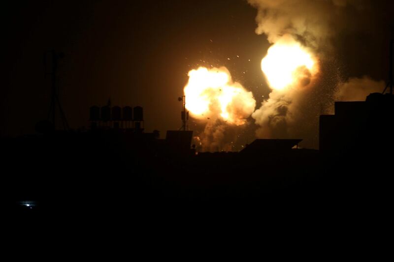 Flame and smoke are seen during Israeli air strikes in the southern Gaza Strip. REUTERS