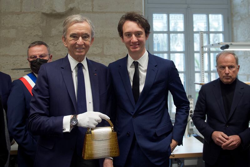 LVMH chairman Bernard Arnault and his son, Frederic, chief executive of TAG Heuer, attend the opening of the company's new workshop in Vendome. AFP