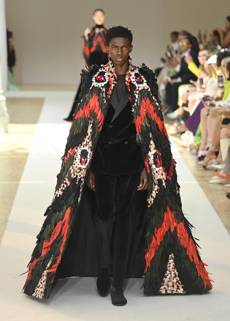 This feathered cape was a debut look in Paris. Getty