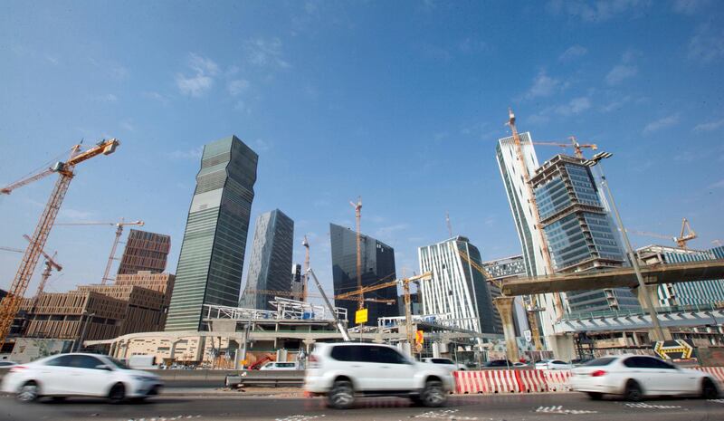 FILE PHOTO: Cars drive past the King Abdullah Financial District in Riyadh, Saudi Arabia, November 12, 2017. Picture taken November 12, 2017. REUTERS/Faisal Al Nasser/File Photo