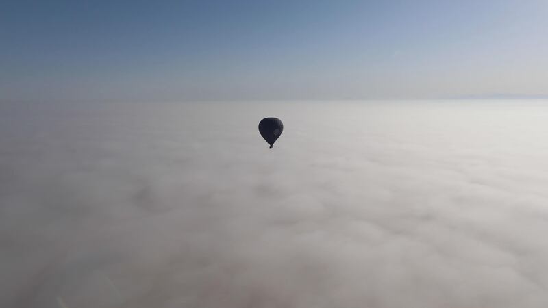 Balloon above the fog. Andy Scott / The National
