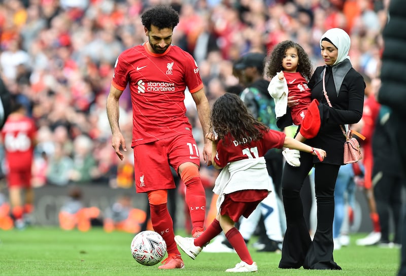 Liverpool's Mohamed Salah and his family on the pitch at the end of the Premier League season. EPA