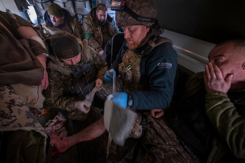A Ukrainian soldier is taken to a field hospital. EPA