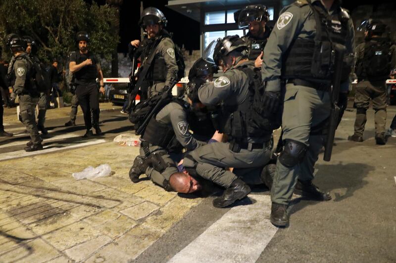 Israeli police officers detain a Palestinian demonstrator during clashes. Tensions have been running high over the possible eviction of  Palestinian families near the Damascus Gate. AP Photo