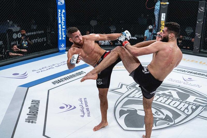 Joan Arastey and Omran Chaaban exchange kicks in the UAE Warriors-18 middleweight contest at the Jiu-Jitsu Arena on Saturday, March 20, 2021. Courtesy Palms Sports