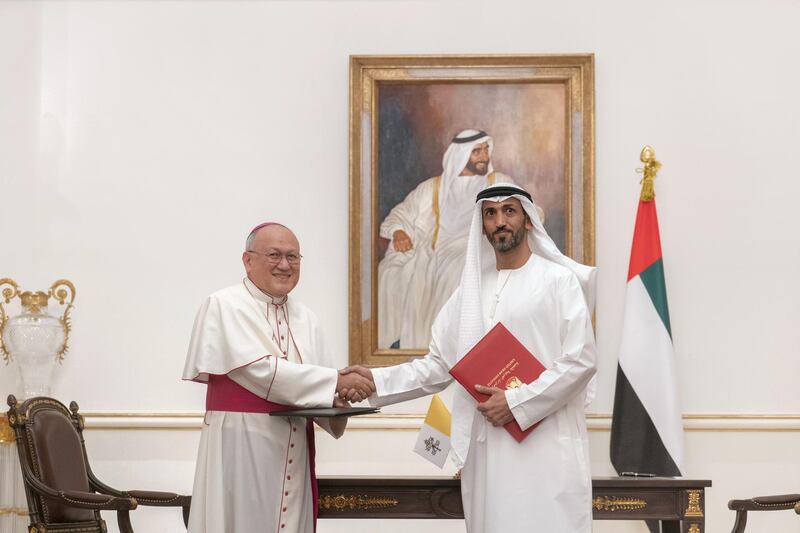 ABU DHABI, UNITED ARAB EMIRATES - November 18, 2019: HE Mohamed Mubarak Al Mazrouei, Undersecretary of the Crown Prince Court of Abu Dhabi (R) and His Grace Archbishop Francisco Montecillo Padilla, personal envoy of His Holiness Pope Francis (L), stand for a photograph after signing of a collaborative declaration on global health, at the Sea Palace.

( Rashed Al Mansoori / Ministry of Presidential Affairs )
---