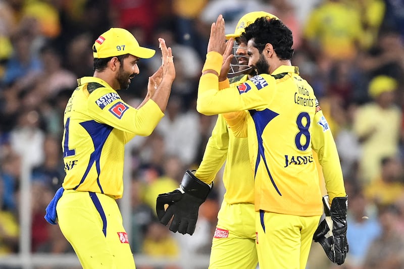 Chennai Super Kings' players celebrate after the dismissal of Gujarat Titans' Shubman Gill. AFP