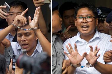 Myanmar journalists Kyaw Soe Oo, left, and Wa Lone are escorted from the court in Yangon on September 3, 2018. AP Photo