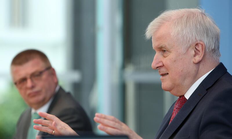 epa08536189 German Federal Interior Minister Horst Seehofer (CSU, R) and Thomas Haldenwang, president of the German federal office for protection of the constitution (Verfassungsschutz, or BfV) attend a news conference in Berlin, Germany, 09 July 2020. The Federal Office for the Protection of the Constitution presented its annual report for 2019.  EPA/ADAM BERRY / POOL