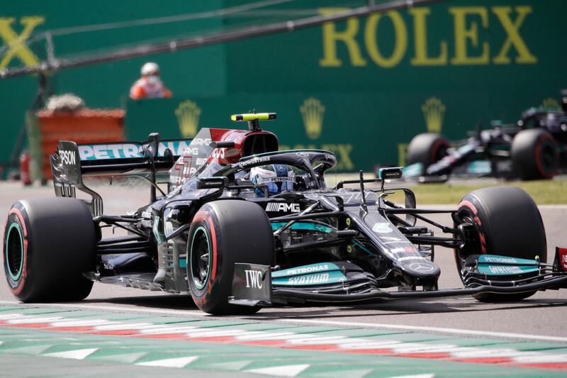 Mercedes driver Valtteri Bottas of Finland is followed by Mercedes driver Lewis Hamilton of Britain during qualifying practice for Sunday's Emilia Romagna Formula One Grand Prix, at the Imola track, Italy, Saturday, April 17, 2021. (AP Photo/Luca Bruno)