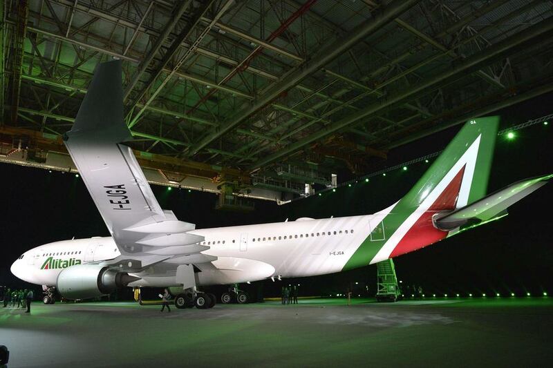 An aircraft airbus A330-200 from Italy's Alitalia is pictured during a press conference to present the new brand design and the new livery on June 4, 2015 at Fiumicino airport, near Rome.  Andreas Solaro / AFP

