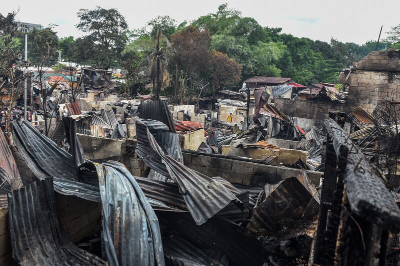 Eight people died, including six children, when the fire ripped through the community in Metro Manila.