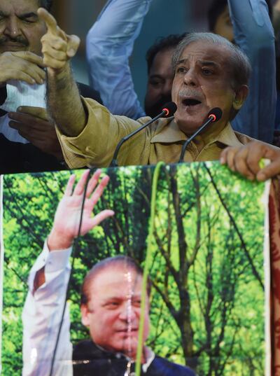 Shahbaz Sharif, the younger brother of ousted Pakistani prime minister Nawaz Sharif and the head of Pakistan Muslim League -Nawaz (PML-N), delivers a speech during an election campaign meeting in Karachi on June 26, 2018. Pakistan's forthcoming elections, scheduled for July 25, are expected to pit the PML-N against its main rival, the Pakistan Tehreek-e-Insaf party led by former cricketer Imran Khan. / AFP / ASIF HASSAN
