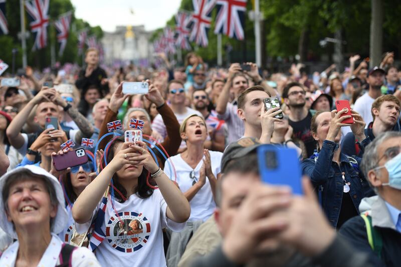 Crowds gather to watch a flypast by the Red Arrows during Queen Elizabeth's platinum jubilee celebrations. EPA 