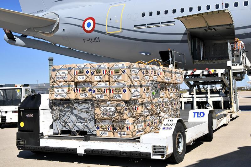 Medical and sanitary supplies are loaded aboard a Airbus A330 as France is sending search and rescue experts aboard three military planes loaded with a mobile clinic and tonnes of medical equipment to Beirut, Roissy airport, near Paris.  EPA