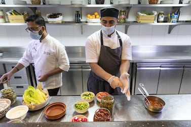 Staff at the Radisson Blu Hotel Dubai Waterfront prepare food ahead of iftar. Antonie Robertson / The National