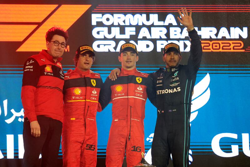 Right to left: Hamilton on the podium alongside Charles Leclerc, Carlos Sainz and Ferrari team principal Mattia Binotto after the 2022 Bahrain Grand Prix. Reuters