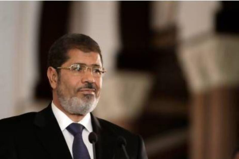 Mohammed Morsi has attempted to quell unrest after a week of demonstrations by an opposition that has long been suspicious of the Islamist president and his allies.