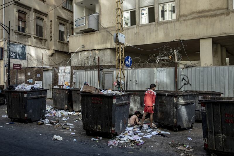 Children search for food in rubbish bins in Lebanon's capital.