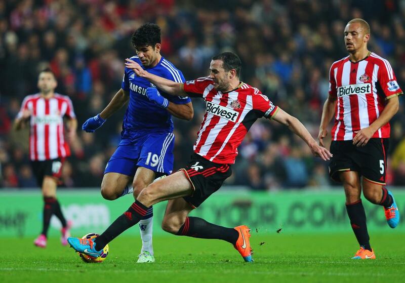 John O’Shea of Sunderland challenges Diego Costa of Chelsea during the Barclays Premier League match between Sunderland and Chelsea at Stadium of Light on November 29, 2014 in Sunderland, England. Photo by Alex Livesey/Getty Images