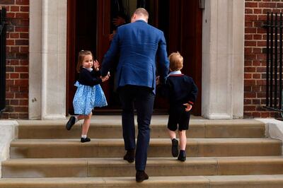 Princess Charlotte of Cambridge (L) turns to wave at the media as she is lead in with her brother Prince George of Cambridge (R) by their father Britain's Prince William, Duke of Cambridge, (C) at the Lindo Wing of St Mary's Hospital in central London, on April 23, 2018, to visit Catherine, Duchess of Cambridge, and their new-born son.  
Kate, the wife of Britain's Prince William, has given birth to a baby son, Kensington Palace announced Monday. "Her Royal Highness The Duchess of Cambridge was safely delivered of a son at 11:01 (1001 GMT)," the palace said in a statement. The baby boy weighs eight pounds and seven ounces (3.8 kilogrammes).
 / AFP PHOTO / Ben STANSALL