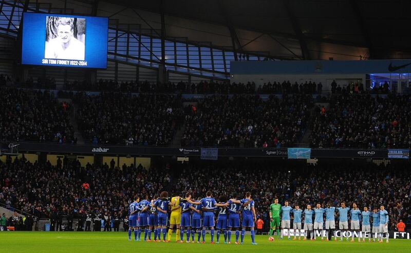 Chelsea and Manchester City stand for a minute's silence in memory of Tom Finney before the match on Saturday. Andrew Yates / AFP