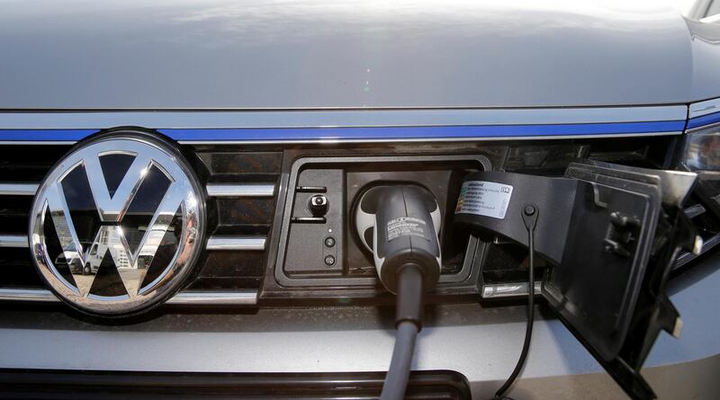 FILE PHOTO: The charging plug of an electric Volkswagen Passat car is pictured at charging station at a VW dealer in Berlin, Germany, February 2, 2016.  REUTERS/Fabrizio Bensch/File Photo