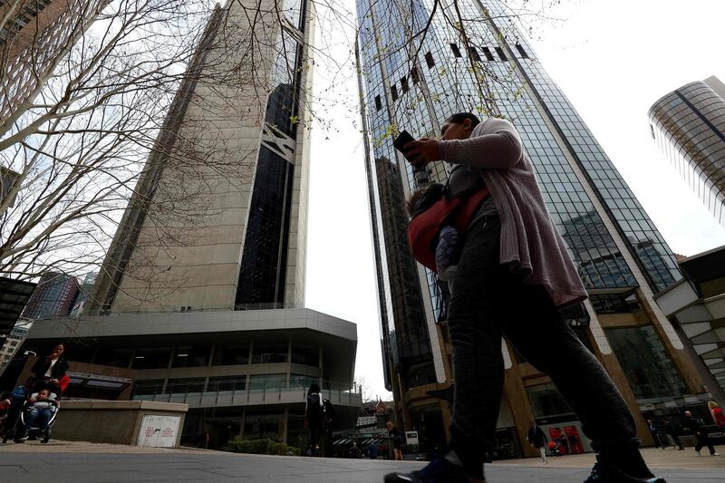 A woman walks through the central business district of Sydney on September 5, 2018. - Australia's buoyant economy posted strong growth in the second quarter of the year on the back of increasing exports, consumer and government spending, official data showed on September 5. (Photo by Saeed KHAN / AFP)