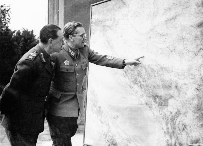Field Marshal Harold Alexander,  left, confers over a large map with Gen Josip Tito at the latter's residence, the White Palace in Belgrade. Tito was president of Yugoslavia from 1953 until his death in 1980. Getty