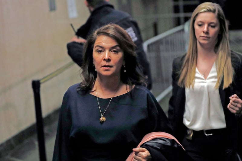 Actress Annabella Sciorra, left, leaves Manhattan Criminal Court after appearing at Harvey Weinstein's rape and sexual assault trial, Thursday, Jan. 23, 2020, in New York. (AP Photo/Kathy Willens)