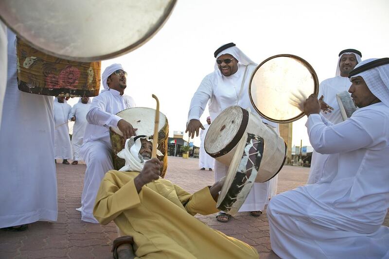 Hilal Kadim al Kaabi (centre)of Al Ain, beats his drum while he performs with the Banikaab, a drum and al yolla group based in Al Ain, at the fourth annual Zayed Heritage Festival. Silvia Razgova / The National